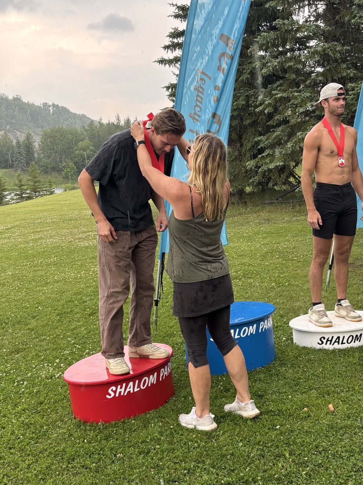 Kristy Kraus presenting medals at the Junior Canadian Open on the Shalom Park podium