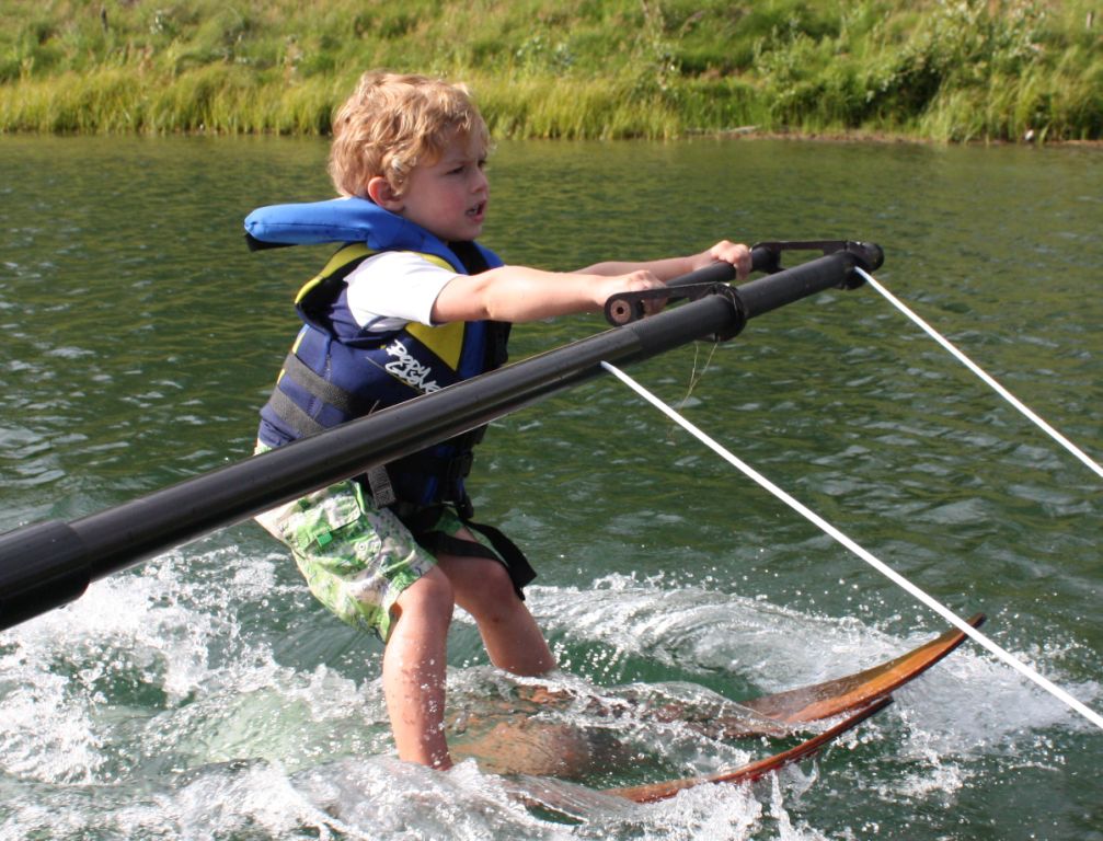 Young child learning to waterski on the boom at Shalom Park — proof that anyone can do this
